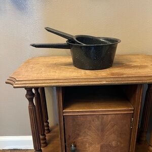 Pair of vintage black and white speckled enamelware sauce pans